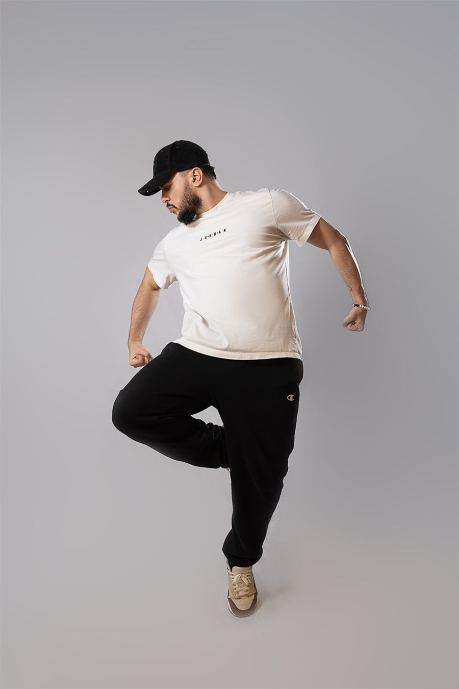 Brasileirada instructor striking a dance pose on one leg