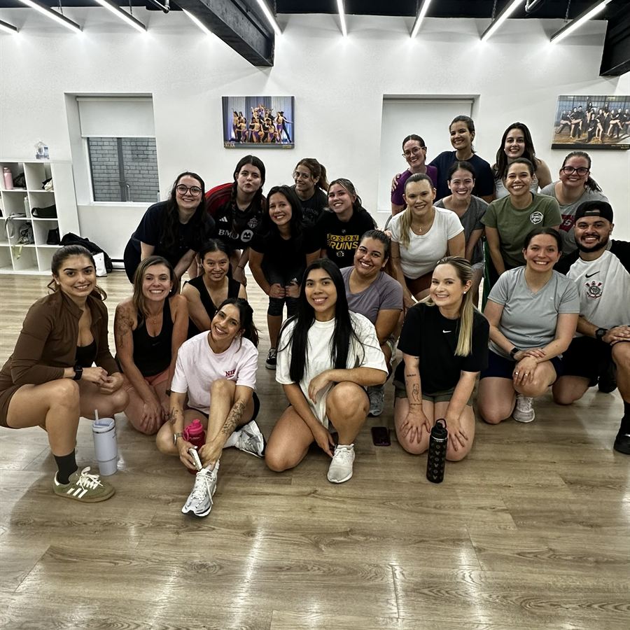 Brasileirada class posing together on the studio floor